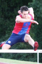 Conquering the Hurdles of Managing IT Production. Andrew Howell, Harrow, Middlesex and England hurdler. Photo used by permission.